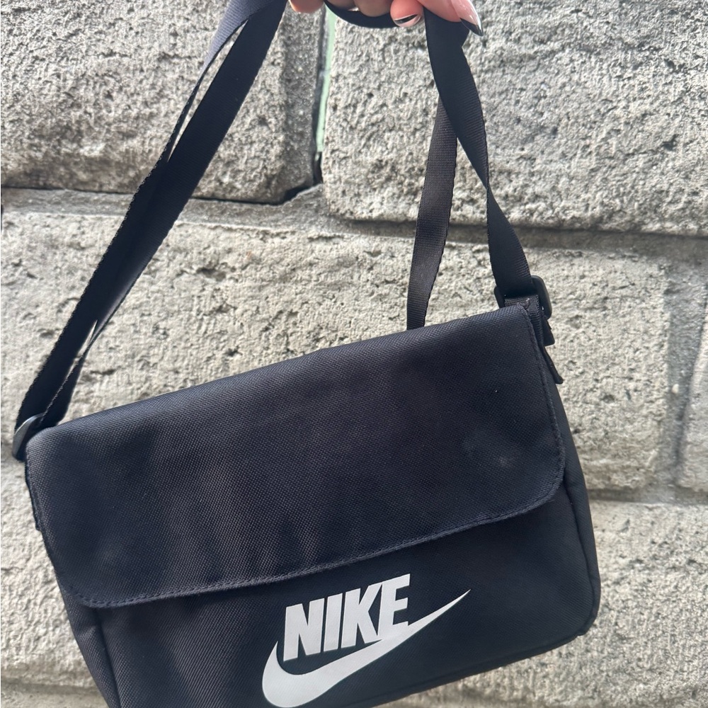 Nike Black Messenger Bag with Adjustable Strap and Flap Closure